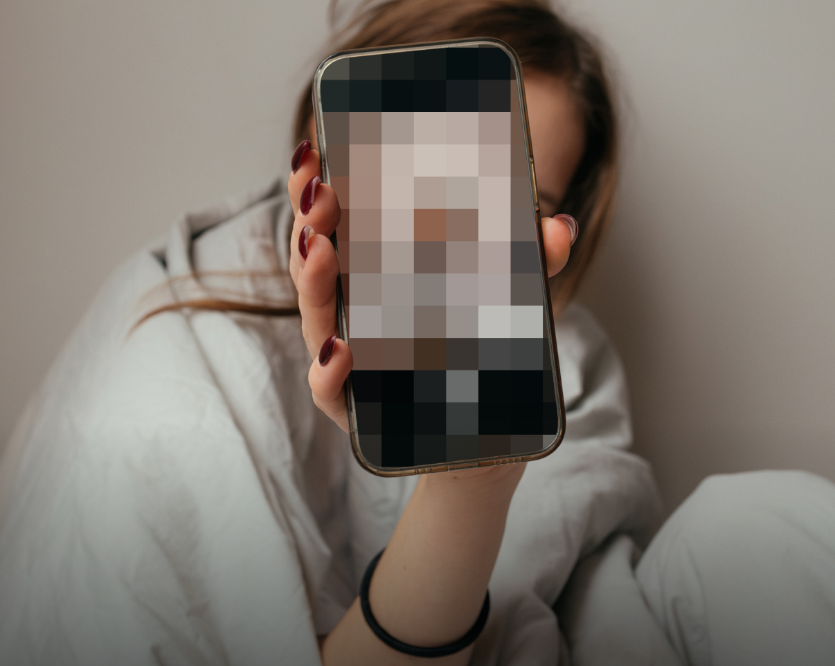 Child holding phone with pixelated screen