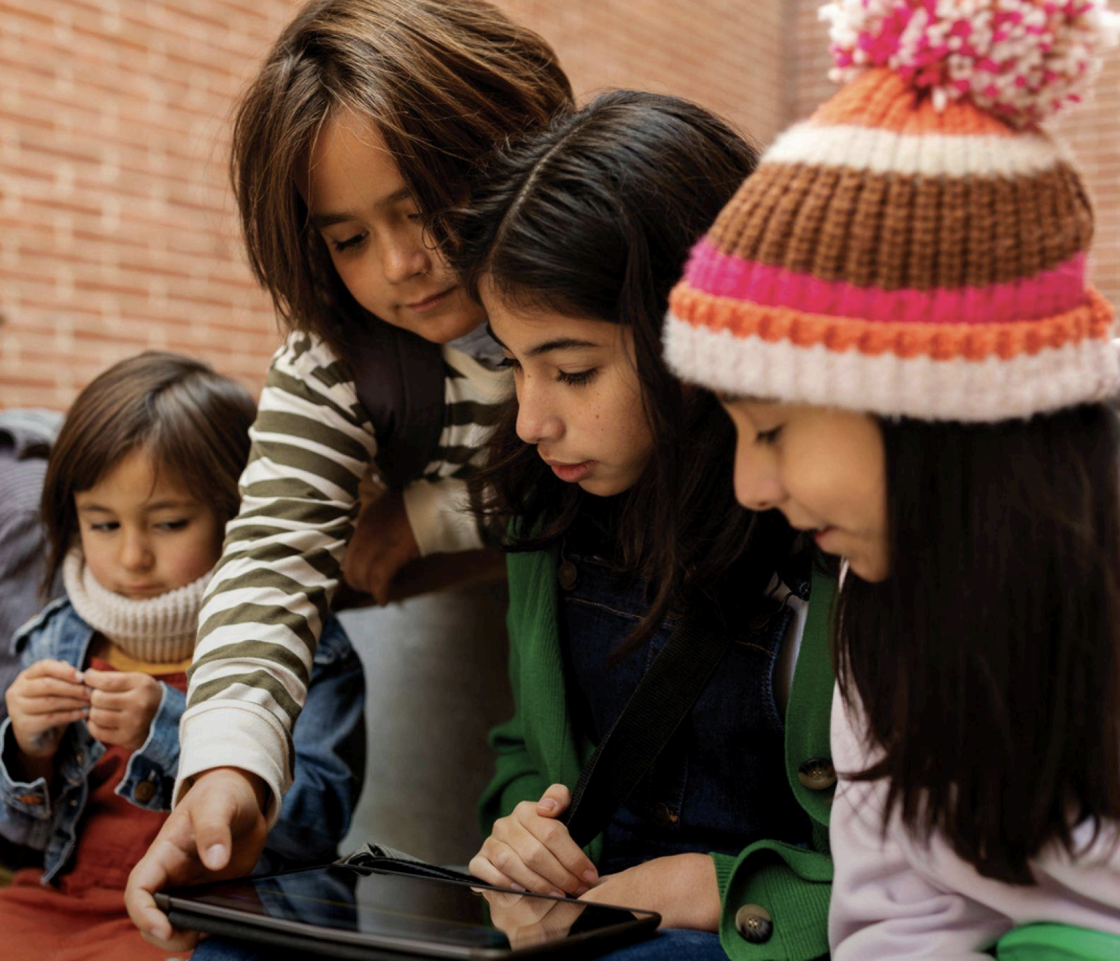 Children looking at iPad
