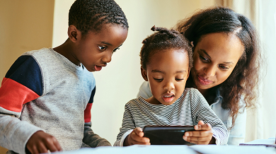 Family looking at phone