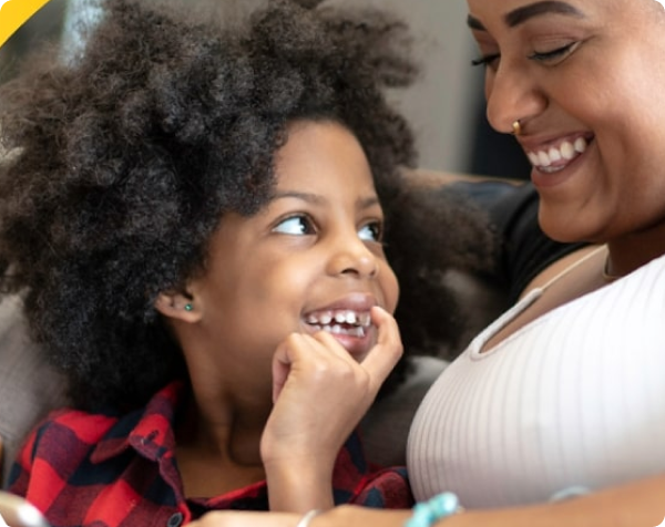 Young child looking at their mom