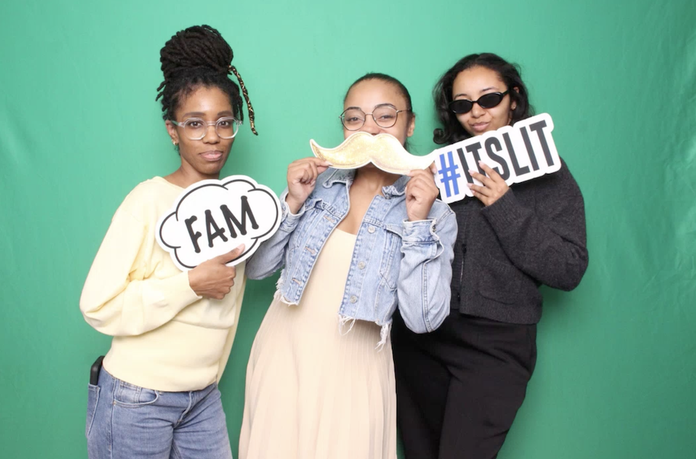 Three Common Sense Media employees in a photobooth