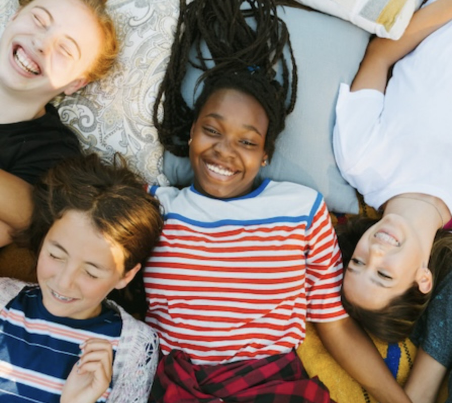 Kids smiling and lying down